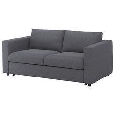 a gray couch sitting on top of a white floor