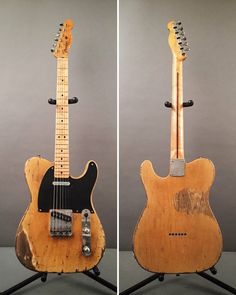 two guitars sitting side by side, one is made out of wood and the other has an electric guitar