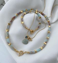 And we came up with a wonderful Larimar stone design. This perfect set, consisting of 2 necklaces and 1 bracelet with tastefully designed gold-plated filled hearts and a magnificently detailed Gemici lock, has been carefully produced. Any letter you want can be used. Don't you think it's a perfect piece? 😍 İrem accessory is here with a design difference. Letter Jewelry, Larimar Stone, Stone Design, Necklace Bracelet, Stone Necklace, Bracelet Set, Pendant Necklaces, Necklaces Bracelets, Jewelry Necklace Pendant