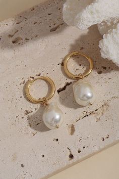 Elevate your outfit with Artsory's "Timeless Pearl" 14k Gold Hoop Earrings. Exuding understated elegance, these hoop pearl earrings feature lustrous 14k gold plating and unique shell baroque pearls. They add a touch of sophistication to any ensemble, making them a versatile and enduring addition to your jewelry collection. Bridal Piercings, Elegant Tarnish Resistant Huggie Pearl Earrings, Elegant Tarnish-resistant Huggie Pearl Earrings, Fashion Jewelry Photography, Jewelry Marketing, Unique Pearl Earrings, Jewellery Shoot, Blink Blink, 14k Gold Hoop Earrings