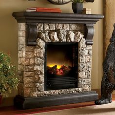 a stone fireplace with a clock above it