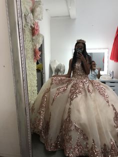 a woman taking a selfie in a wedding dress while standing in front of a mirror