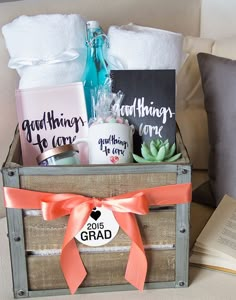 a wooden crate filled with books and personalized gifts for someone's graduation party