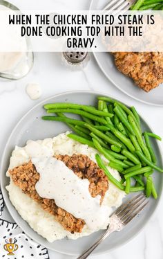 two plates with green beans, mashed potatoes and meat on them that says when the chicken fried steak is done cooking top with the gravy