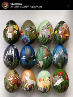 an assortment of painted eggs with animals on them