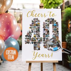 a sign that says cheers to 50 years with photos and balloons in front of it