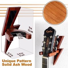 the unique guitar stand is made out of wood and has an attached shelf for storing guitars