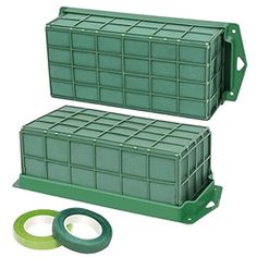 two green plastic containers sitting next to each other