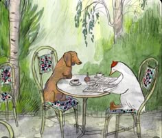 two dogs are sitting at a table outside