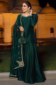 Gorgeously mesmerizing is what you will look at the next social function by wearing this dark green silk lehenga which will surely tell them that the diamonds aren't the only beautiful thing which they have seen.This sweetheart neckline and full sleeve blouse embellished in hand work.Teamed up with silk flared style lehenga in dark green color with dark green organza dupatta.Flared style lehenga is plain.Dupatta decorated using hand work.This lehenga blouse can be customised up to maximum size a Full Sleeve Blouse, Pakistani Wedding Outfits, Lehenga Blouse, Simple Pakistani Dresses