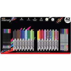 an assortment of markers and pencils with different colors on the front, including one in black