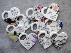 wedding favors are arranged in the shape of hearts with names and date printed on them