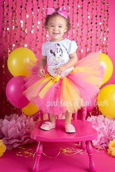 This set is perfect for a Baby Minnie themed party! Set includes pink and yellow VERY FULL 4 layer tutu,custom tee with name,and matching ears! Please leave name and age info in the note box during checkoutIf you are unsure of sizing please scroll to the last photos for our size charts, or visit our size charts here--> https://pinktoesnhairbows.com/pages/size-chartAll sales are FINAL, Ship dates can be found directly on the listing, please view our policies in detail here---> https://pinktoesnhairbows.com/pages/policies-terms-conditions *****Due to Many Request,Bows are No longer included on the shoulders of the shirts***** Minnie Mouse Tutu, Mouse Outfit, Pink Toes, Baby Minnie, Baby Minnie Mouse, Custom Tee, Note Box, Pink And Yellow, Custom Tees