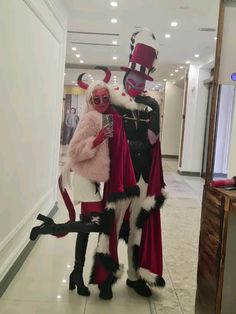 two people in costumes standing next to each other