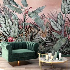 a living room with green couches and wallpaper that has leopards in the jungle