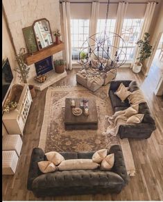 an aerial view of a living room with couches