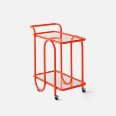 an orange cart with wheels and a glass top on the bottom, sitting against a white background