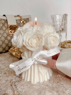 a bride's bouquet with white roses and a name on it