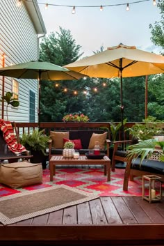 an outdoor patio with chairs, tables and umbrellas on it's deck area