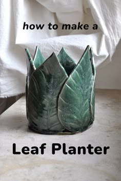 a green planter sitting on top of a counter next to a white towel with the words how to make a leaf planter