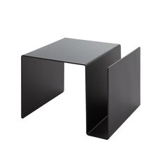 a black side table with one end open and the other half turned upside down, on a white background