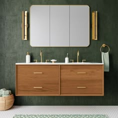 a bathroom with green walls and two sinks under a large mirror on the wall above it