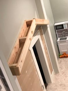 an unfinished kitchen under construction next to a washer and dryer