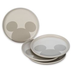 the mickey mouse plates are stacked on top of each other