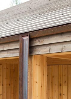 two wooden garage doors are open on the outside