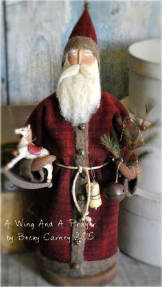 a santa clause doll with reindeers and bells