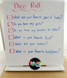 a white board with writing on it that says dice roll what was your favorite part of today? do you have any pets?