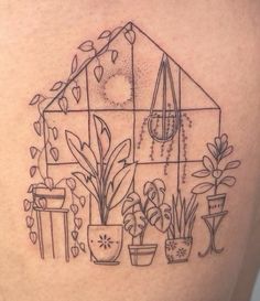 a woman's thigh with potted plants on it