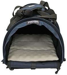 a blue dog carrier with the door open to allow it's bed for dogs