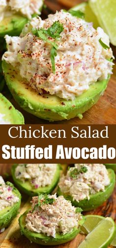 chicken salad stuffed avocado on a cutting board with limes and cilantro