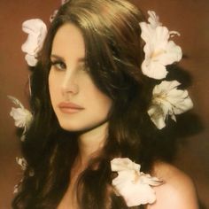 a woman with long hair and flowers in her hair