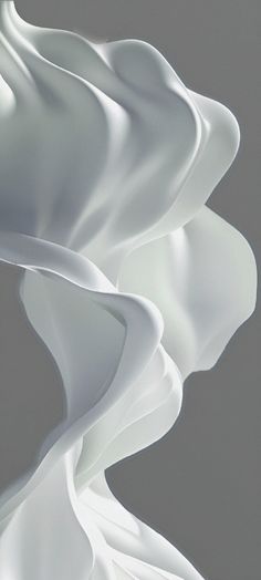 an abstract photograph of white flowing fabric