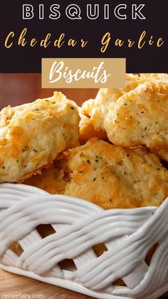 biscuits in a white basket with the words bisquick cheddar garlic biscuits