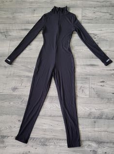 Elevate your school spirit with a custom 1 of 1 HBCU jumpsuit -- designed exclusively for you! Whether you're preparing for Homecoming, stepping out for an alumni event, or repping your school pride on campus, this sleek black jumpsuit will make you stand out. Made from a super-stretch blend of 95% polyester and 5% spandex, this piece is crafted for ultimate comfort, contouring your body with a form-fitting silhouette that moves with you. Designed with long sleeves featuring thumb holes for a sporty, modern edge, and "Lucky Label" embroidered on the cuffs for a touch of style, this jumpsuit offers a seamless, streamlined look that's both flattering and versatile. The high neckline and front zipper closure add to the sleek design, making this jumpsuit perfect for layering or wearing on its Designer Overalls, Alumni Events, Womens Jumpsuits, Designer Jumpsuits, School Pride, 1 Of 1, School Spirit, Thumb Holes, Black Jumpsuit