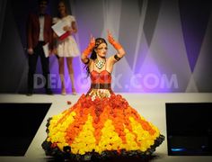 'Super Nova' pictured on the catwalk during the Junk Kouture Recycled Fashion competition grand finale in 2013. Junk Kouture Recycled Fashion, Fashion Competition, Super Nova, Metal Bottle, Paper Napkins, Dream Wardrobe