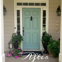 a blue front door with potted plants on the porch and welcome sign above it