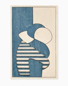 a wooden cutout with lines and shapes on it