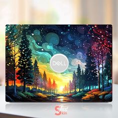 the dell laptop has been painted with colorful trees and stars on it's screen