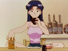 a woman sitting at a table in front of bottles and a cell phone with her hands on her hips