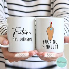 two people holding coffee mugs with writing on them that read future mrs smith engaged at front and back