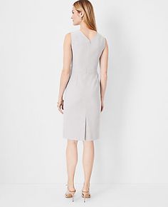 Elevate your wardrobe with the Ann Taylor Double V Seamed Sheath Dress, a testament to sophisticated styling and comfort. This dress features a unique double V-neck at the front and back, enhancing its elegant silhouette. 

- Size: 18 Regular
- Color: Pebble Grey Melange
- Gender: Female
- Material: 66% Polyester, 28% Rayon, 6% Spandex; Lining: 100% Polyester
- Length: 25" from natural waist
- Fit: Tailored fit
- Care: Machine washable

Crafted in a bi-stretch fabric that maintains its shape whi Female Features, Knitted Suit, Pebble Grey, The Double, Sophisticated Style, Sheath Dress, Effortless Style, Ann Taylor, Gender Female