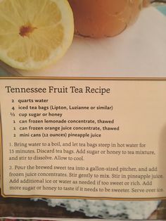 a sign describing the ingredients for a tea recipe with oranges and lemon slices on it