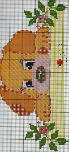 a cross stitch pattern with a dog and flowers on it