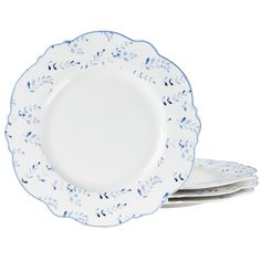 three white plates with blue designs on the rims and one has two silver forks