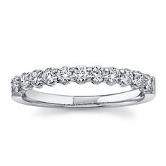 a white gold wedding band with round cut diamonds