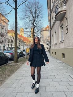 Hairstyles | Beauty | Outfits on Instagram: Black Loafers Skirt Outfit, Tennis Skirt Blazer Outfit, Plated Black Skirt Outfit, Winter Looks With Skirts, Tennis Skirt Office Outfit, Black Loafer White Socks Outfit, Loafer Party Outfit, Pleated Skirt With Loafers, Black Skirt Loafers Outfit